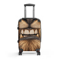 A hard-shell rolling suitcase with an all-over novelty print of a lion's face, featuring a black telescoping handle and four spinner wheels, shown on a plain white background.